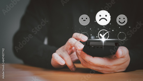 Business service concept of customer experience dissatisfied. Customer give the feedback with angry emotion face on virtual screen. Assessment testimonial review for dislike service and low quality.