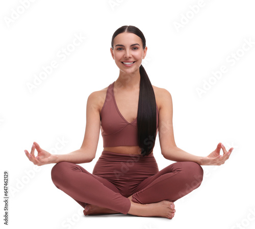 Beautiful young woman practicing yoga on white background. Lotus pose