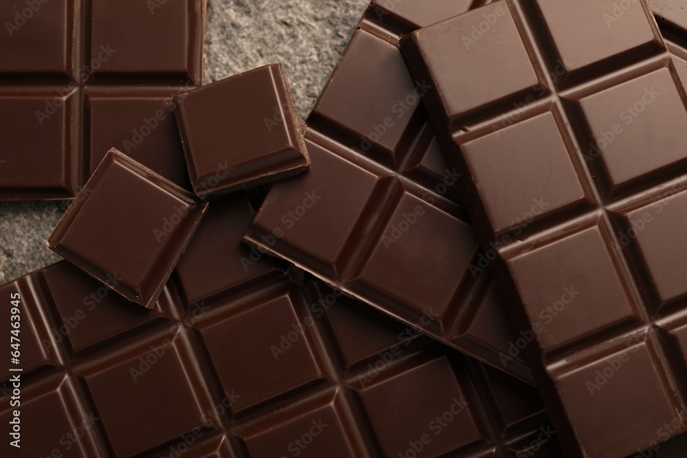 Delicious dark chocolate on grey table, closeup Delicious dark chocolate on grey table, closeup
