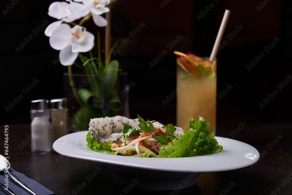 Shrimp bowl and lemonade. Pan-asian dish set on a dark table Shrimp bowl and lemonade. Pan-asian dish set on a dark table
