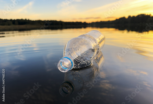 Litter in Waterways as problems for environment. Refuse in storm drains. Waste Plastic bottle for recycling and re-use. Reduce garbage. River clean-ups. Ocean pollution and Microplastics in water. photo