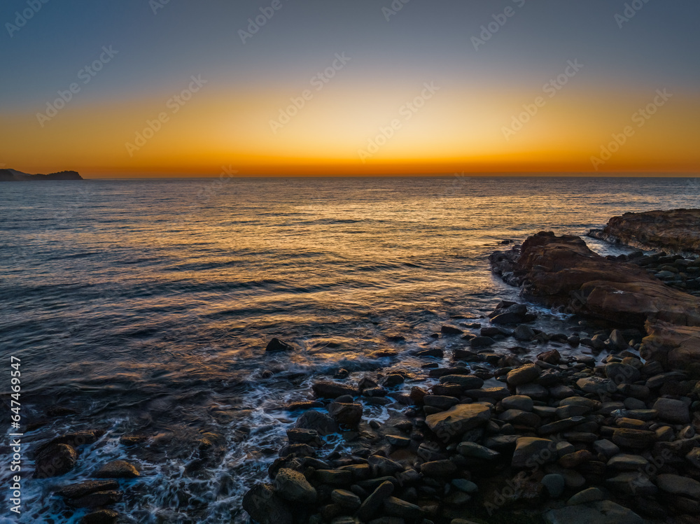 Sunrise over the ocean with orange horizon Sunrise over the ocean with orange horizon