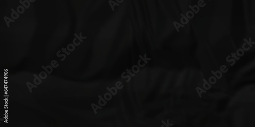 Dark crumple black paper wrinkled poster template ,blank glued creased paper texture background. black paper crumled backdrop background. used for cardboard and clarkboard.