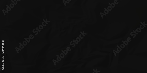 Dark crumple black paper wrinkled poster template ,blank glued creased paper texture background. black paper crumled backdrop background. used for cardboard and clarkboard.