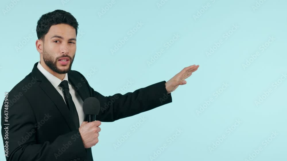 Face, man and news presenter on microphone in studio isolated on a blue background mockup space. Portrait, reporter and professional speaking on broadcast media, press and tv host explaining on show Face, man and news presenter on microphone in studio isolated on a blue background mockup space. Portrait, reporter and professional speaking on broadcast media, press and tv host explaining on show