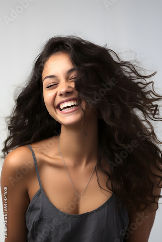 A captivating photo of a beautiful mixed-race young woman with a dazzling smile, radiating boundless joy, happiness, and infectious positivity.