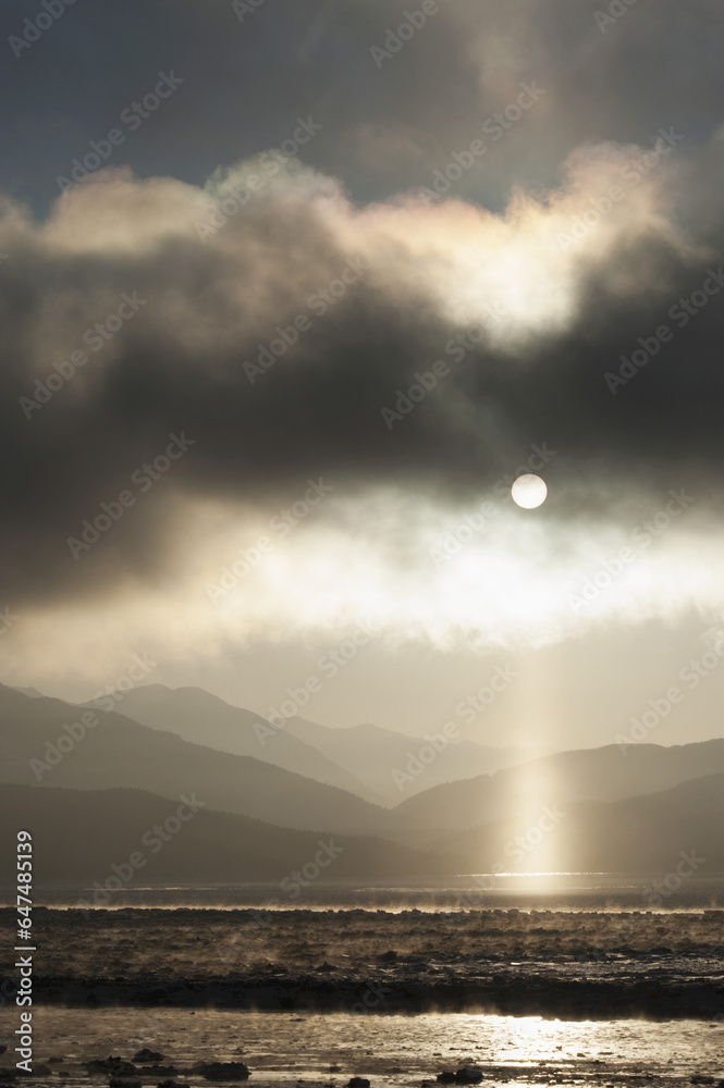 Pillar Of Light Appears As Fog Lifts Over Turnagain Arm; Alaska, United States Of America Pillar Of Light Appears As Fog Lifts Over Turnagain Arm; Alaska, United States Of America