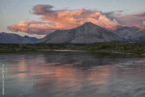 The Midnight Sun Shines On The Mountains And Clouds Lining The Wind River In The Peel Watershed; Yukon, Canada photo