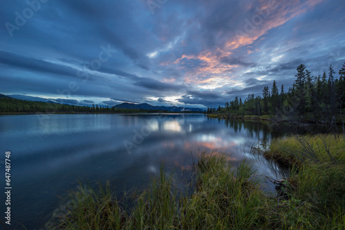 Sunset Lights Up A Swath Of Clouds Over Jackfish Lake; Yukon, Canada photo