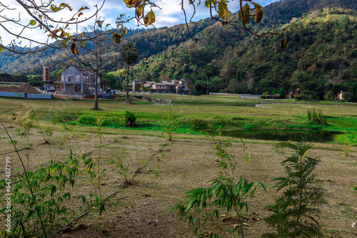 The natural background of colorful flower beds, with chairs to sit and rest while watching the scenery, the wind blows through the blur, cool and comfortable. photo