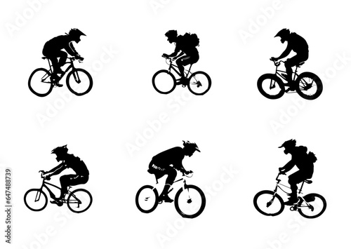 Fototapeta Naklejka Na Ścianę i Meble -  Silhouette of boys riding a bicycle
