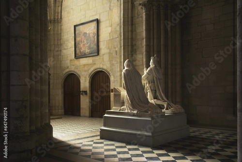 The Statue Of A Royal Couple Caught In Beautiful Light In The Grandiose Basilica Of Saint Denis; Paris, France