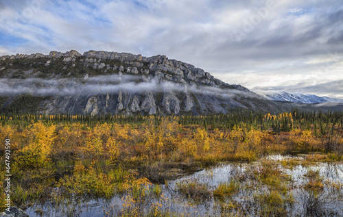 The Limestone Cliffs Of Sapper Hill During Autumn Along The Dempster Highway; Yukon, Canada photo