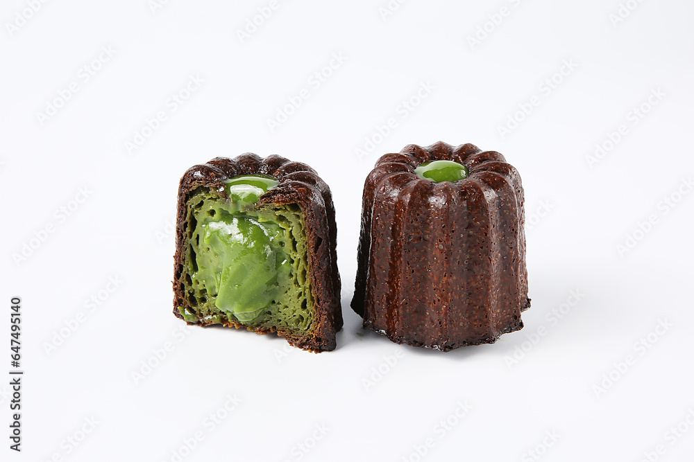 Cannelés,(canneles),traditional French dessert cake, indoor photography studio shot, close-up, clean background Cannelés,(canneles),traditional French dessert cake, indoor photography studio shot, close-up, clean background