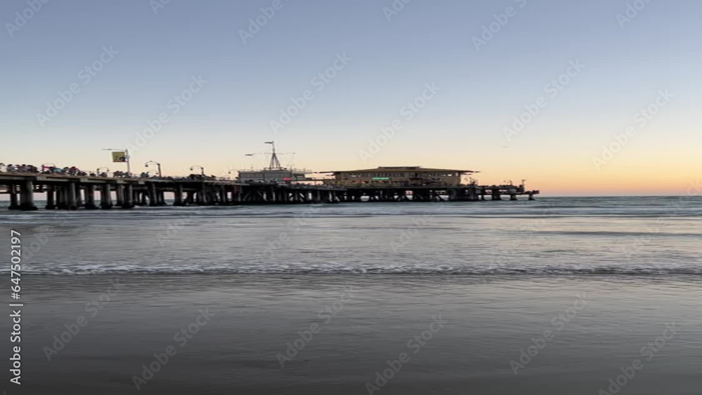 vertical video touristy pier at sunset beach vertical video touristy pier at sunset beach