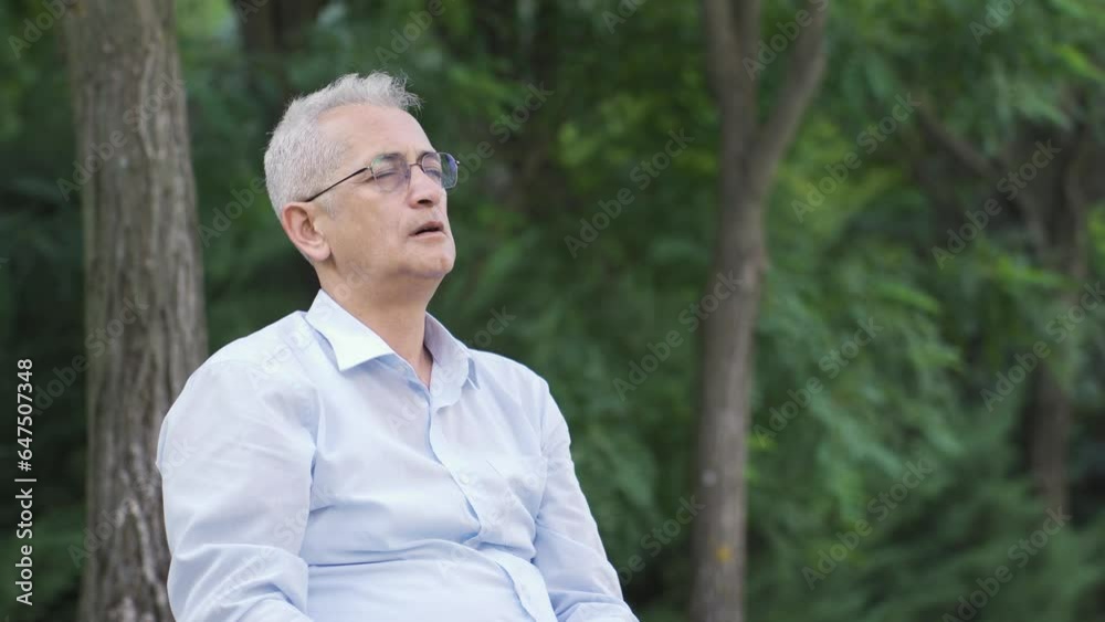 The man with the fever is sitting outside. The man with the fever is sitting outside.