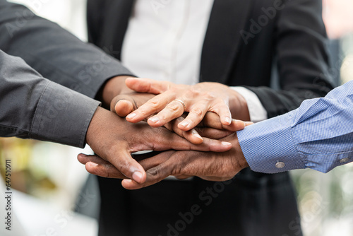 Teamwork Close-up of business people..Laying hands to encourage work Unity.