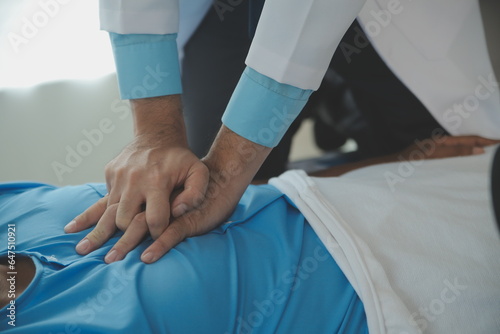 Medical professionals provide assistance to patients with unconscious, using an AED, by placing the electrode in the correct position. medical and healthcare concept. photo