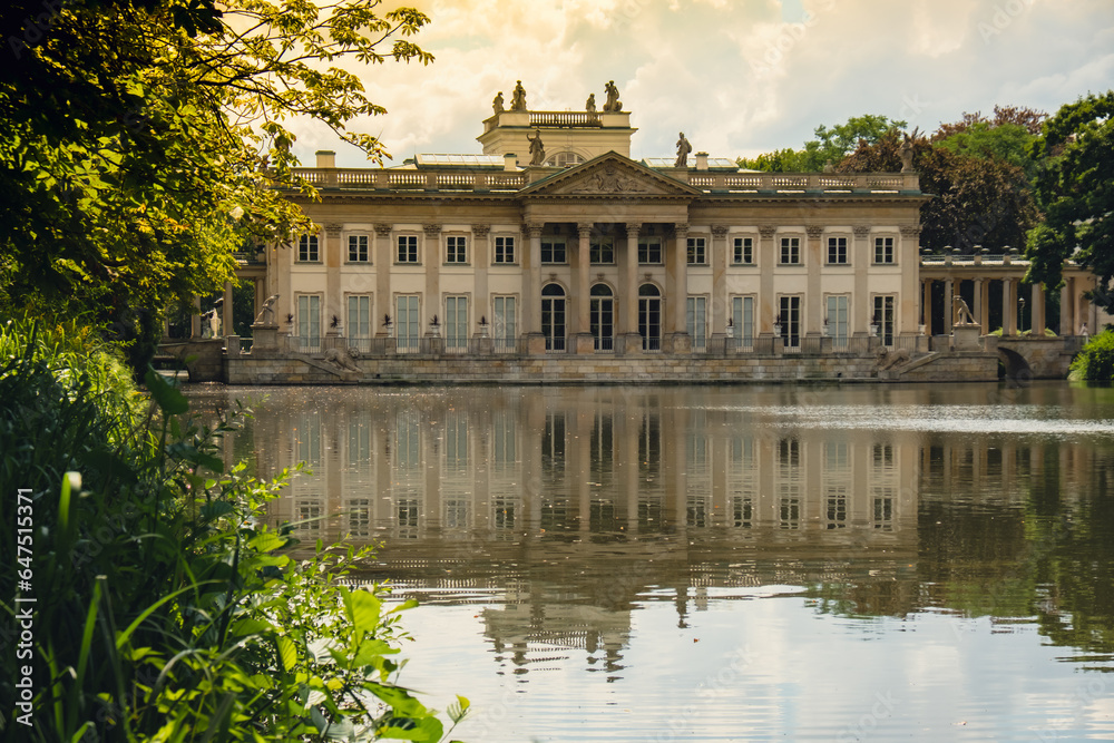 Baths classicist Palace on the Isle in Lazienki Park touristic place in Warsaw. Lazienki Royal Baths Park, Warsaw Poland. Mirror Reflection on the Lake. Nature in summer Baroque columns 