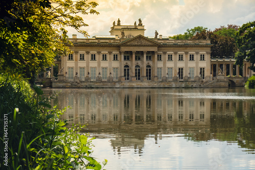 Baths classicist Palace on the Isle in Lazienki Park touristic place in Warsaw. Lazienki Royal Baths Park, Warsaw Poland. Mirror Reflection on the Lake. Nature in summer Baroque columns 