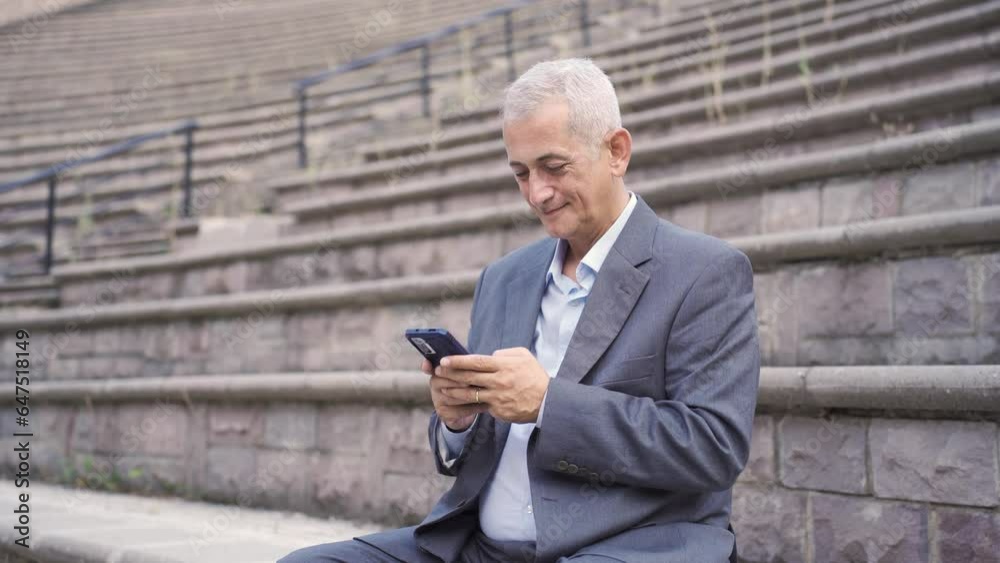 Man chatting on the phone outdoors. Man chatting on the phone outdoors.