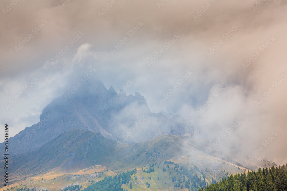 Landscape in the Dolomite Mountains, Italy, in summer, with dramatic storm clouds