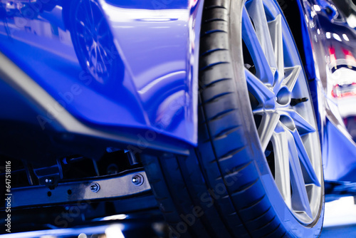 View of the rear of the car, details about the suspension. , blue super sports car wheels, luxury car © TEEREXZ