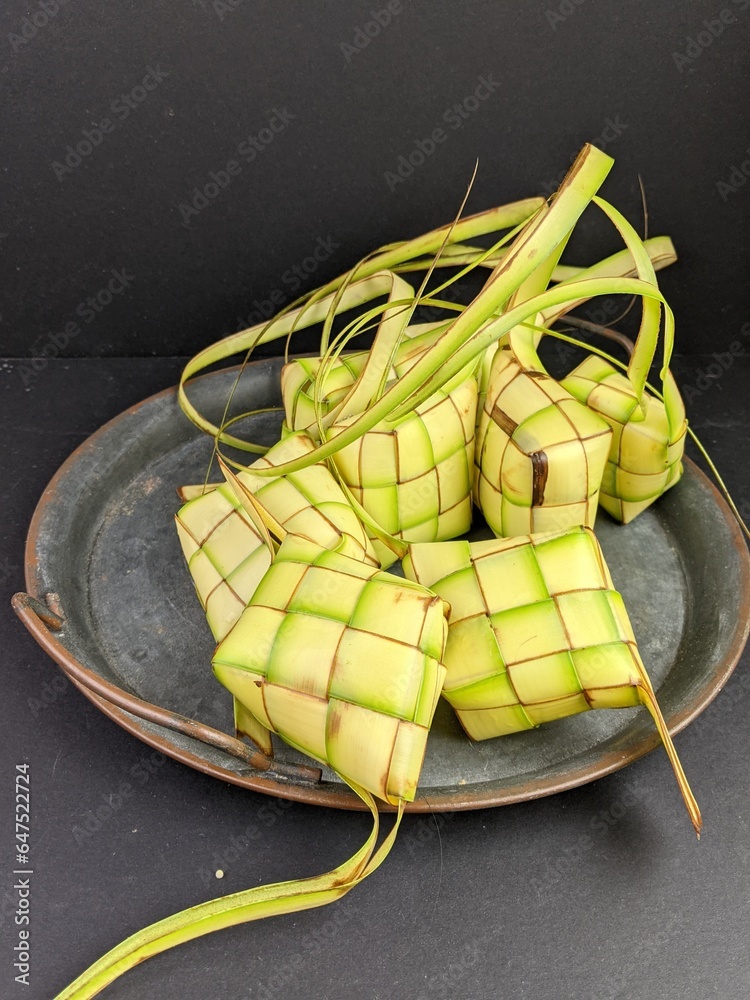 Ketupat (Rice Dumpling) On White Background. Ketupat is a natural rice casing made from young coconut leaves for cooking rice during eid Mubarak