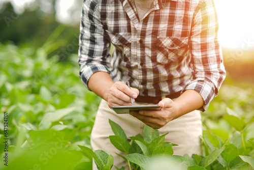 Hands of farmer, Agriculture technology farmer man using tablet Modern technology concept agriculture.