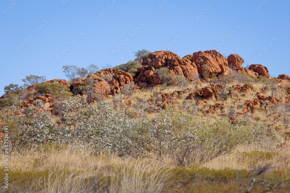 A rocky outcrop rising above the Australian bush in Northern Queensland, Australia A rocky outcrop rising above the Australian bush in Northern Queensland, Australia