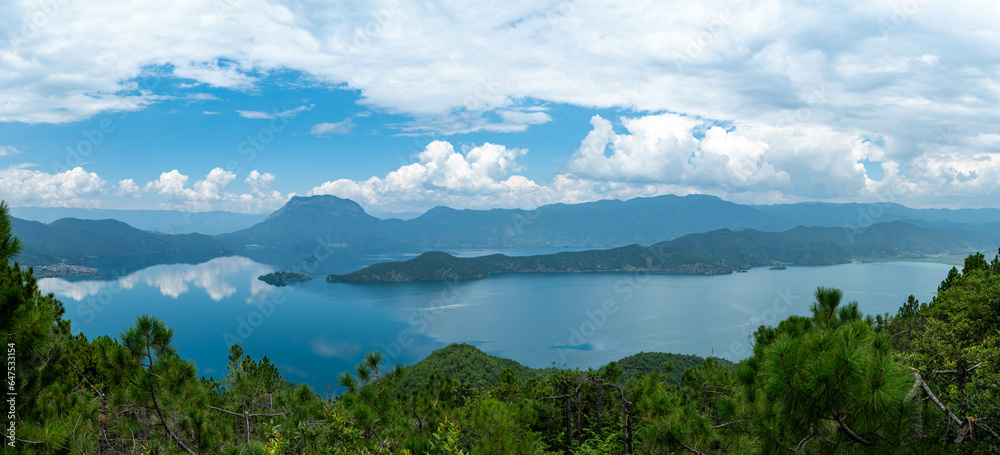 Lugu Lake, surrounded by mountains and clouds