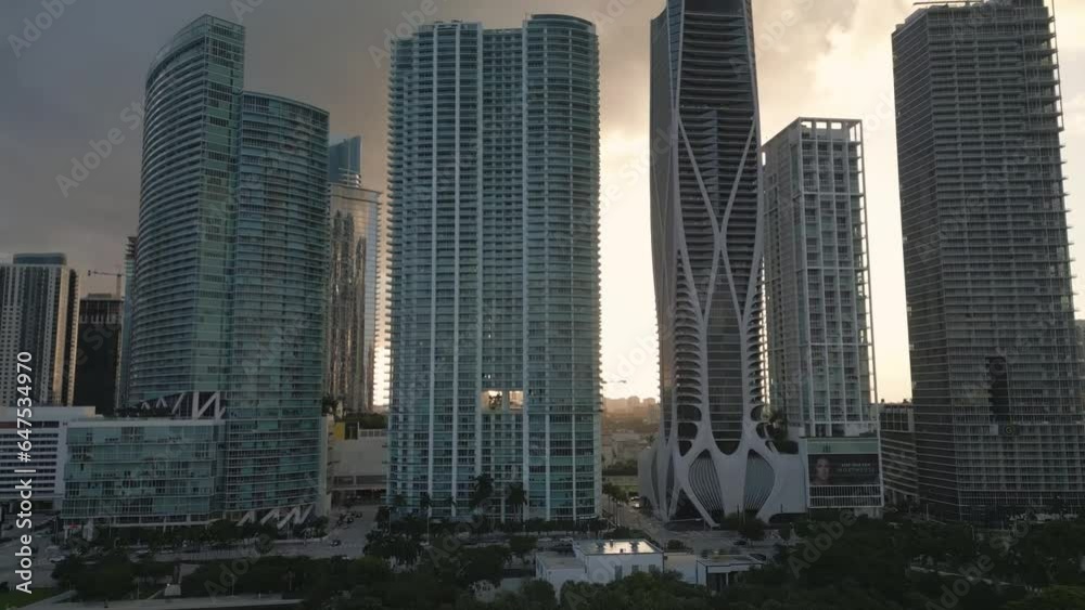 drone approaching Miami Downtown skyline with modern smart home skyscraper building at sunset drone approaching Miami Downtown skyline with modern smart home skyscraper building at sunset