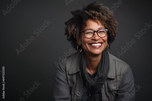 studio portrait of a beautiful Afro woman in her fifties © flydragon