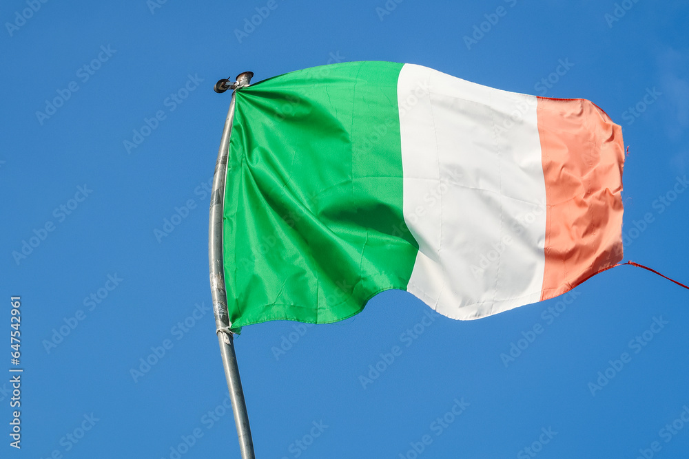 Italian Italy flag hanging waving wind blue sky tricolor green