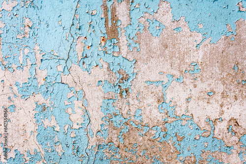 Antique concrete wall painted with blue paint with cracks as texture  pattern  background