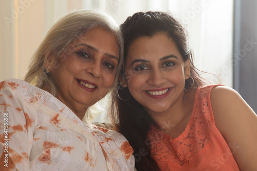 PORTRAIT OF A SMILING ADULT WOMAN AND MOTHER photo