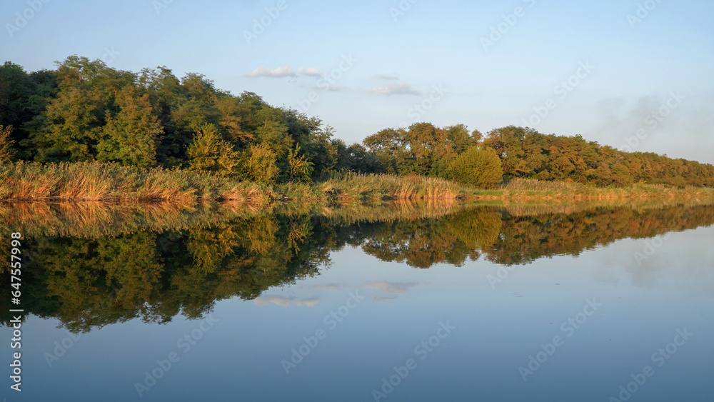 landscape. clouds are reflected in the river