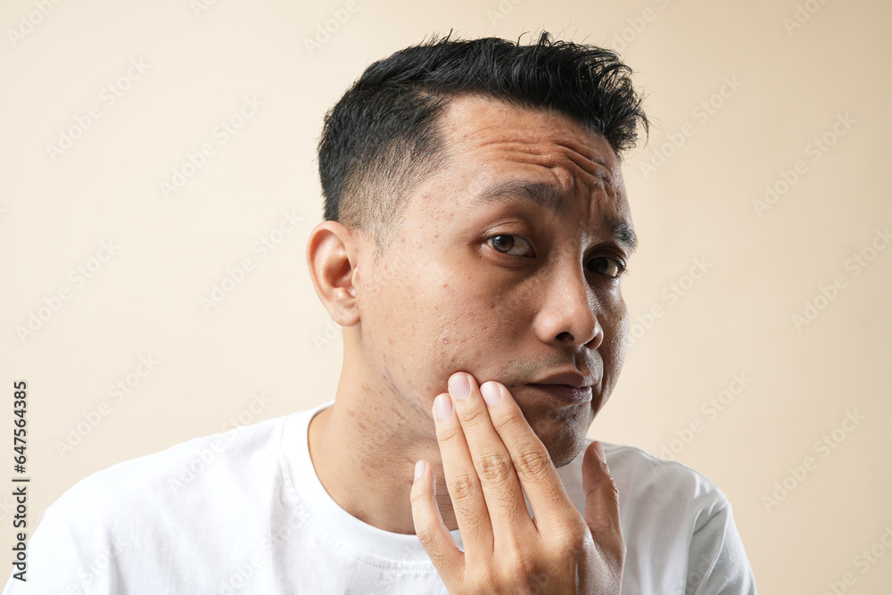 Photo of pores on the skin of the face. Concept Cleansing the face skin and isolated on a cream background. Photo of pores on the skin of the face. Concept Cleansing the face skin and isolated on a cream background.
