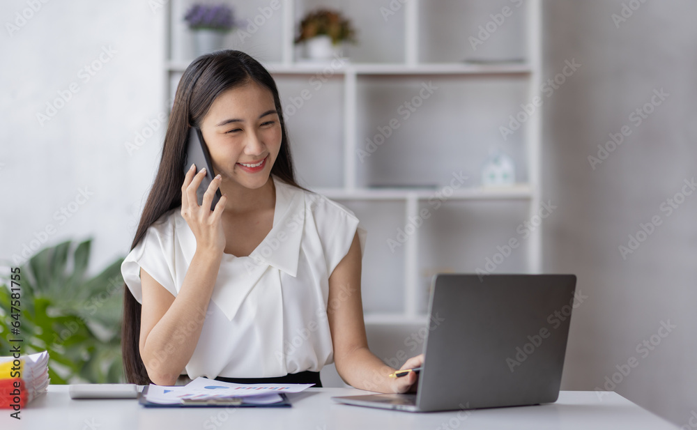 Portrait smile beautiful business asian designer woman working office desk calling and thinking about business. Small business employee freelance online sme marketing e-commerce telemarketing concept Portrait smile beautiful business asian designer woman working office desk calling and thinking about business. Small business employee freelance online sme marketing e-commerce telemarketing concept