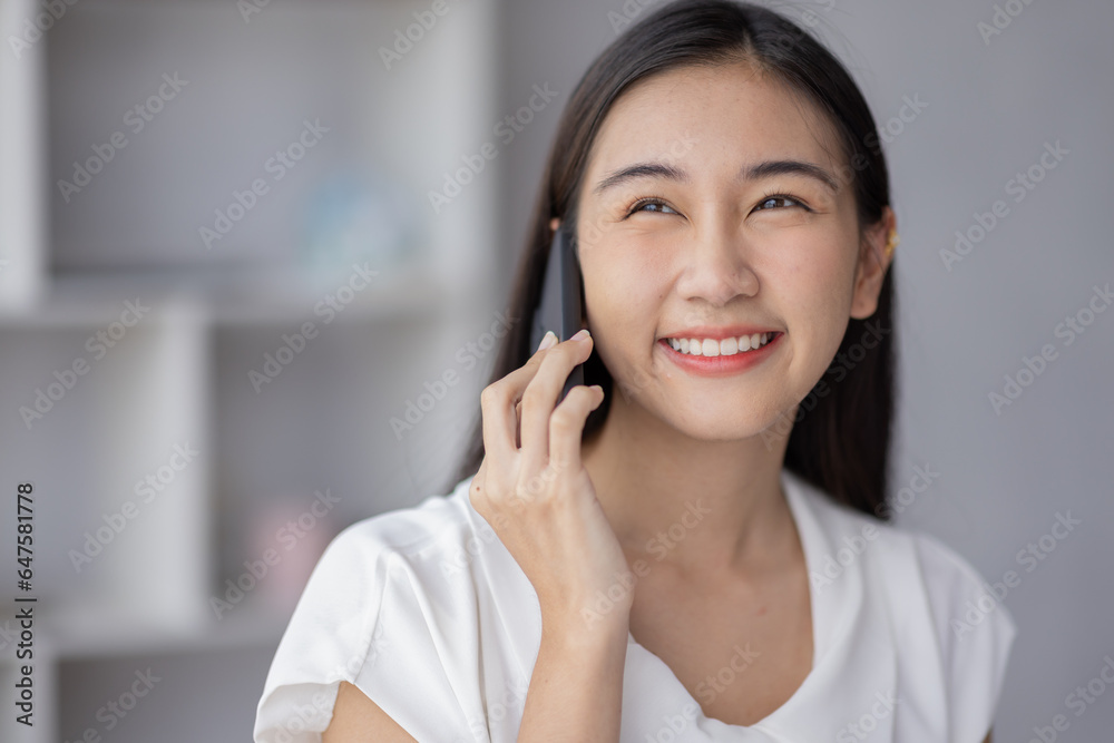 Portrait smile beautiful business asian designer woman working office desk calling and thinking about business. Small business employee freelance online sme marketing e-commerce telemarketing concept Portrait smile beautiful business asian designer woman working office desk calling and thinking about business. Small business employee freelance online sme marketing e-commerce telemarketing concept