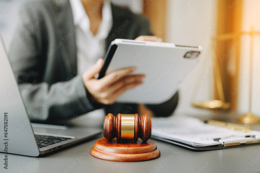Male lawyer in the office with brass scale on wooden table. justice and law concept in morning light. Male lawyer in the office with brass scale on wooden table. justice and law concept in morning light.