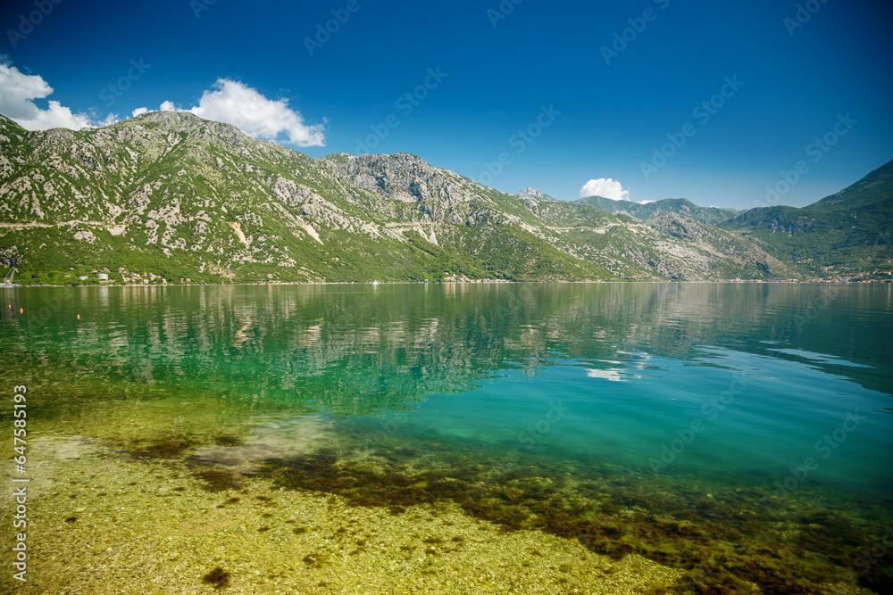View of famous Bay of Kotor with transparent blue sea and mountains on a beautiful sunny day
