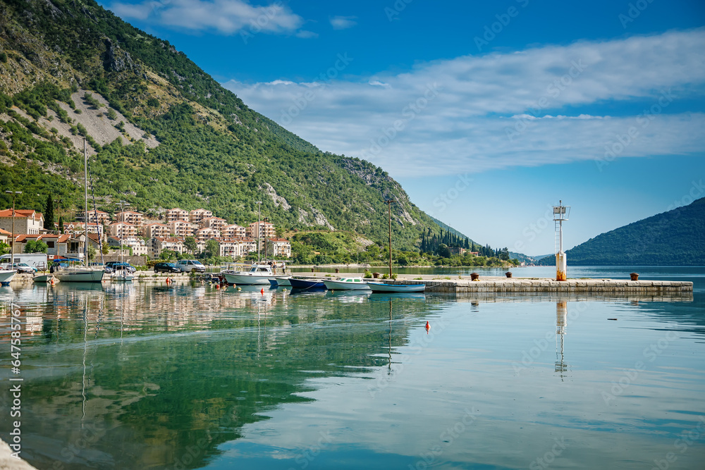 Beautiful view from the embankment of a small town Risan in Bay of Kotor on a sunny day