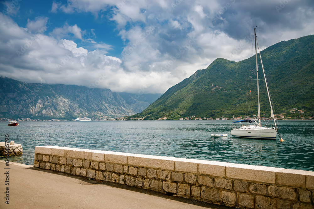 A small yacht sailing in the Bay of Kotor
