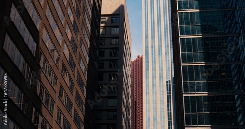 Establishing Shot of Skyscraper Buildings. Architecture in Modern Metropolis. Symbolizing Global Business Wealth Growth and Trade. View of skyscraper buildings. Skyscraper windows in downtown New York