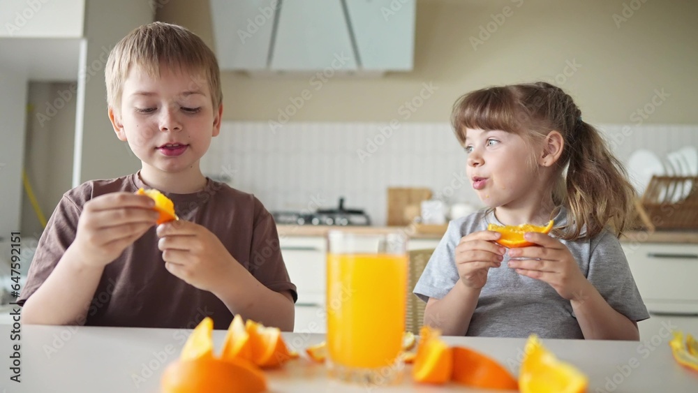 children eat oranges. happy family a kid dream concept. drinking fresh