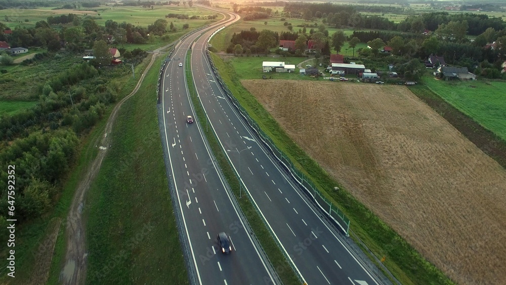 Aerial of Cars on Countryside Highway Road at Sunset