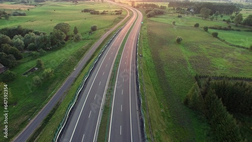 Aerial of Cars on Countryside Highway Road at Sunset