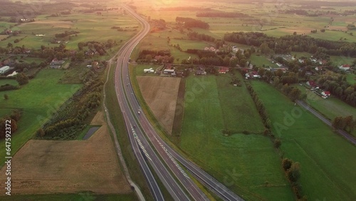 Aerial of Cars on Countryside Highway Road at Sunset