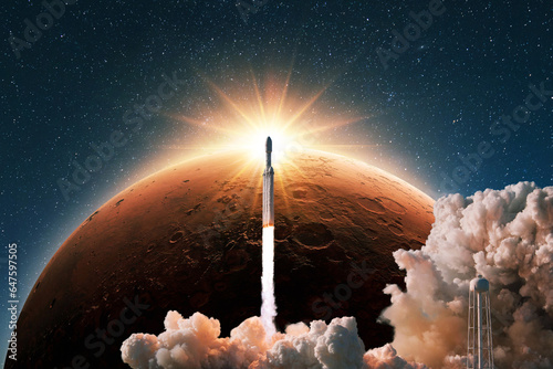 Fototapeta Naklejka Na Ścianę i Meble -  Space rocket with smoke and blast successfully launching to the red planet mars with sun rays. New spaceship lift off into starry space at sunset. Start of a space mission. Rocket, concept